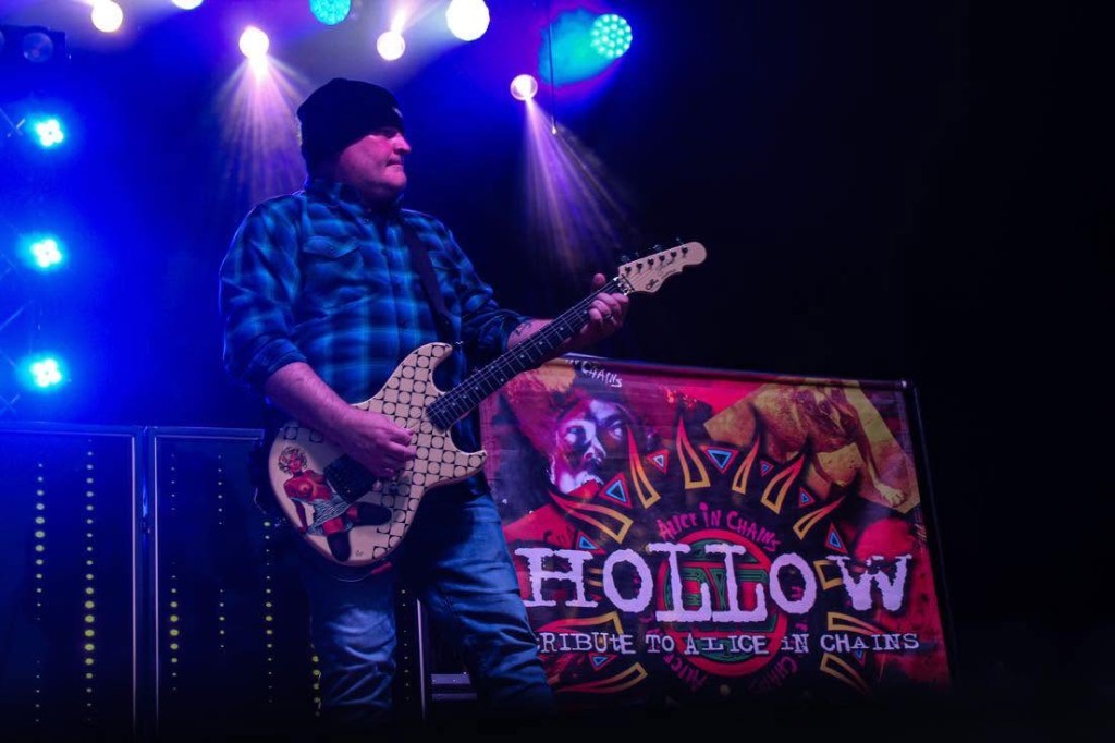 David Peterson performing live on guitar with Hollow
